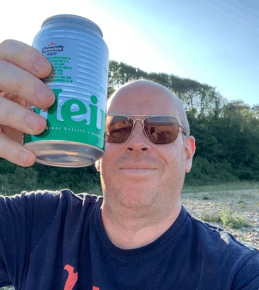 Photo taken drinking alcohol on a beach.