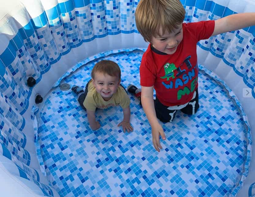 Children enjoying cleaning hot tub