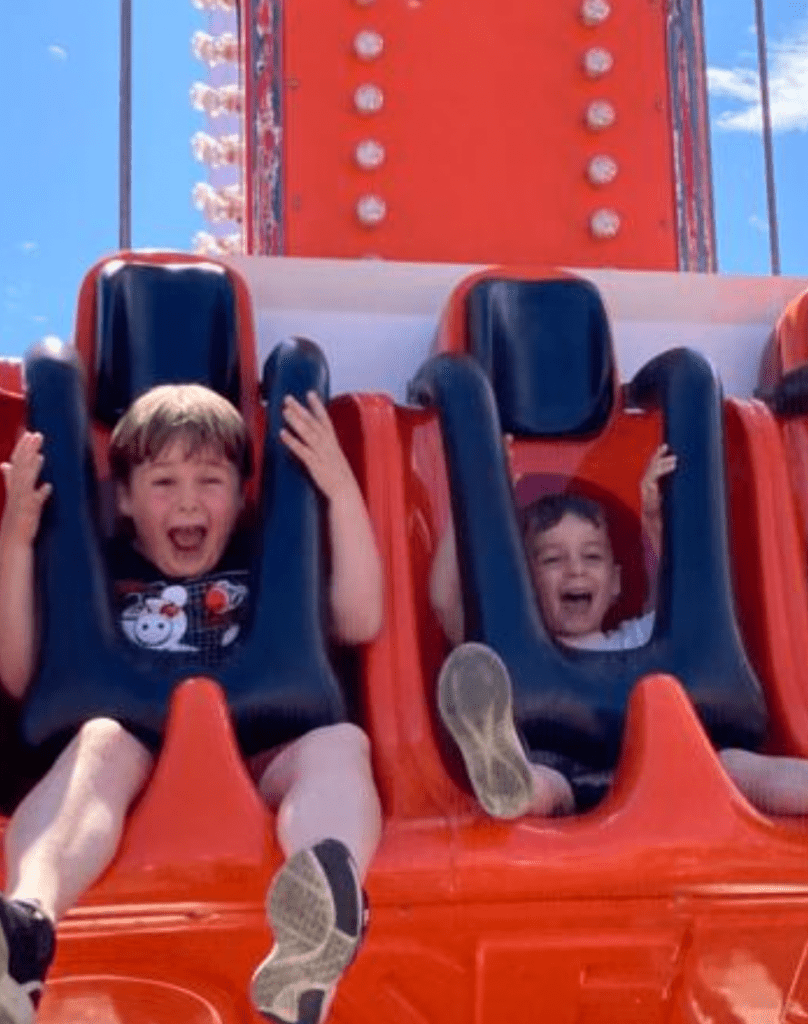 Children on fairground ride in Hastings